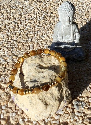 🐅🐯 Très joli bracelet extensible T.standard 18cm. Perles 6mm en véritable Œil de tigre Gold 🐯🐅 Création artisanale. Réalisable en d'autres tailles.